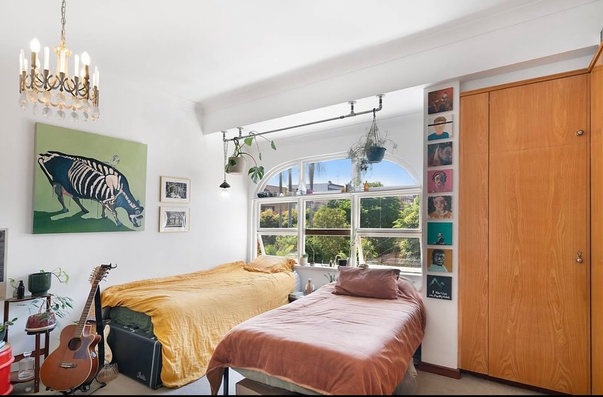 Bright bedroom interior with freshly painted walls and ceiling