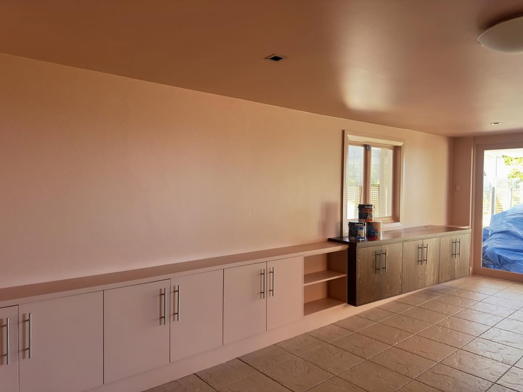 Kitchen cabinetry being repainted by a professional painter