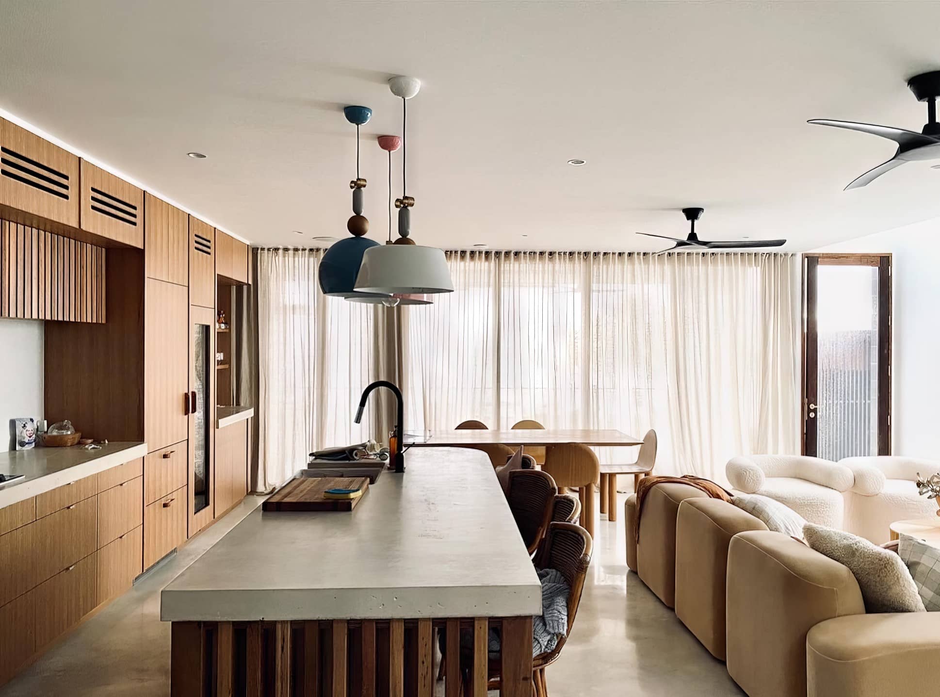 Open plan kitchen and living area with freshly painted walls and timber joinery