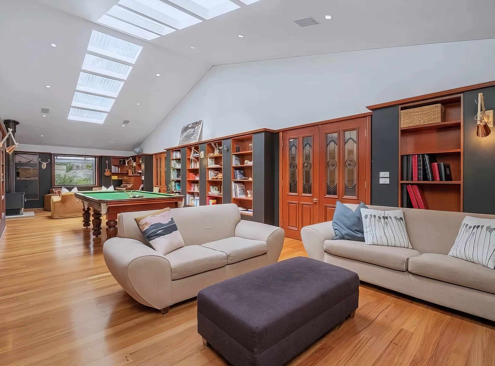 Living room with skylights and a freshly painted ceiling and walls