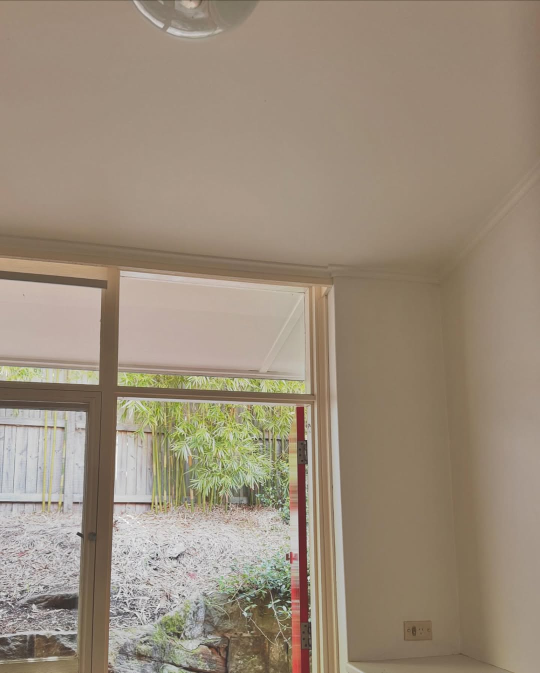 Interior room with garden views and freshly painted walls